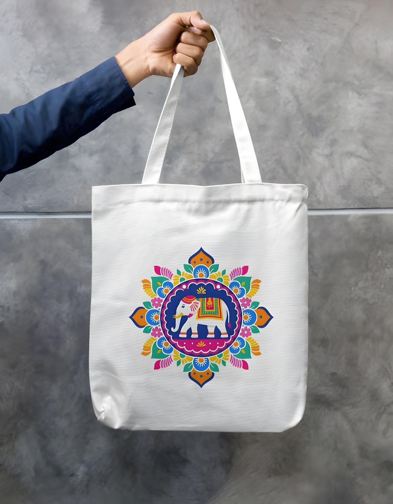 White cotton canvas tote bag with colorful elephant mandala print on both sides, eco-friendly, reusable with zipper closure.